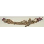A Middle Eastern jambiya or khanjar dagger, 21.5cm curved blade, horn hilt, the scabbard mounted