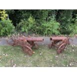 A pair of magnificent and highly decorative cast iron cannons cast in the manner of 18th century