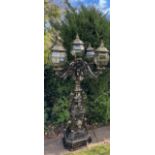 A magnificent and imposing classical cast iron five-light candelabra lamp post in the Gothic manner,