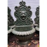 A dramatic and imposing classical cast iron wall font featuring a magnificent roaring lion mask