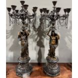 A pair of 19th century French bronze eight-light figural candelabras, each column cast as a
