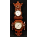 A Victorian Aesthetic Movement oak wall hanging combination timepiece and aneroid barometer,