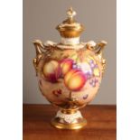 A Royal Worcester ovoid two-handled pedestal vase and cover, painted by Freeman, signed, with ripe