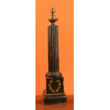 An early 20th century toleware desk lamp, fluted column, the pedestal base painted with laurel
