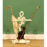 A Victorian cast iron umbrella or walking stick stand, cast as a dog beside an oak tree, removable