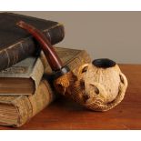 A 19th century Meerschaum pipe, the bowl carved with an eagles foot, 830 silver collar, 15cm wide