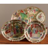 A Chinese Famille Rose kidney shaped dish, typically painted in the Cantonese manner, 27.5cm wide;