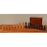 A 19th century boxwood and ebonised chess set, unweighted, the Kings 7cm high, mahogany box with