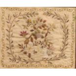 Textiles - a George III needlework sampler, worked with a floral spray within geometric borders,