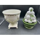 A Majolica glazed fruit pot and urn with lion faces and foliage detail 27cmH