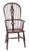 An elm, ash and beech wheelback Windsor elbow chair,