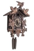 A late-Victorian Black Forest cuckoo wall clock having an eight-day duration movement striking on a