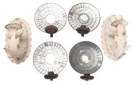 A set of four mirrored glass and metal wall appliques,