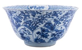 A Chinese blue and white moulded punch bowl, Kangxi with flared foliate rim,