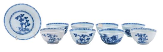 A group of eight Chinese 'Nanking Cargo' blue and white teabowls and one saucer,