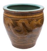 A large Chinese stoneware jardiniere the exterior slip decorated with dragons the interior under