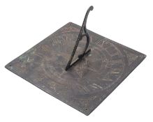 A brass sundial, late 19th / early 20th century; the openwork gnomon on a square plate,