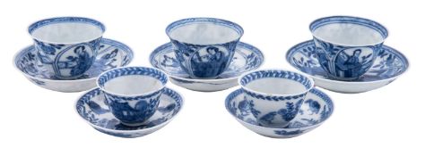 A group of five Chinese toy blue and white teabowls and saucers,