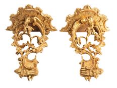 A pair of carved and giltwood wall brackets in Rococo style,
