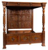 A pair of carved walnut tester beds in 17th Century taste,