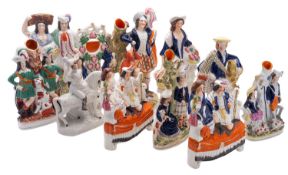 Eleven Staffordshire pottery figure groups,
