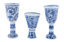 A pair of Chinese blue and white stem cups and a similar octagonal goblet,
