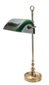 A gilt brass and green glass adjustable desk lamp,