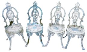 A painted aluminium garden table and four associated chairs en suite,