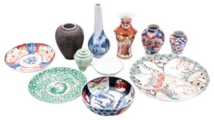 A mixed group of Japanese porcelain, primarily Imari and Kutani and including three plates,