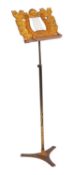 A Regency painted and parcel gilt wood and metal music stand,