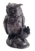 A 'Black Forest' carved and stained tobacco jar modelled as a long-eared owl, probably Swiss,