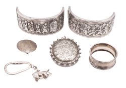 A small mixed lot of silver, to include a bangle (A/F), a locket pendant, a cased pig key ring,