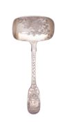 A Victorian silver caddy spoon, with a long, Fiddle pattern stem,