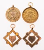 A group of four medallions,