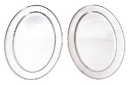 Two modern oval stainless steel oval mea