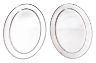 Two modern oval stainless steel oval mea