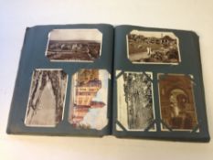 An early 20th Century postcard album. Ma