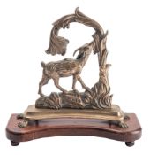 A brass and mahogany mounted door porter