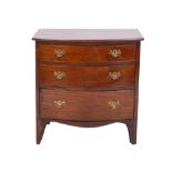 A mahogany bowfronted chest of small size, adapted from a commode,