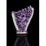 A substantial and impressive rock crystal (amethyst quartz) half geode,