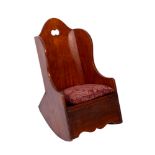 A Child's early 19th century fruitwood rocking chair, the wing back with domed top rail,