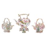 A Coalport flower-encrusted kettle, cover and stand and two shell-moulded teapots and covers,