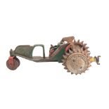An early 20th century American cast iron Model B3 Walking Lawn Sprinkler tractor,