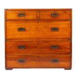 A late 19th/early 20th century teak and brass bound campaign chest of drawers, maker Army & Navy,
