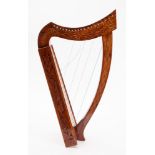 A Titan Celtic 19 string Harp. The line inlaid pillar and neck with carved body, in original bag.