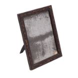 An 18th century black lacquer and gilt chinoiserie easel toilet mirror with a contemporary plate,