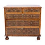 A William and Mary oyster laburnum veneered chest of drawers,