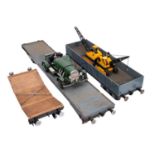 Two scratch built gauge five flatbed trucks.