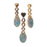 A pair of opal and yellow metal earrings and pendant, with oval cabochon opals,