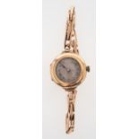 Rolex a 1920s lady's 9k gold wristwatch, the dial with Roman numerals,